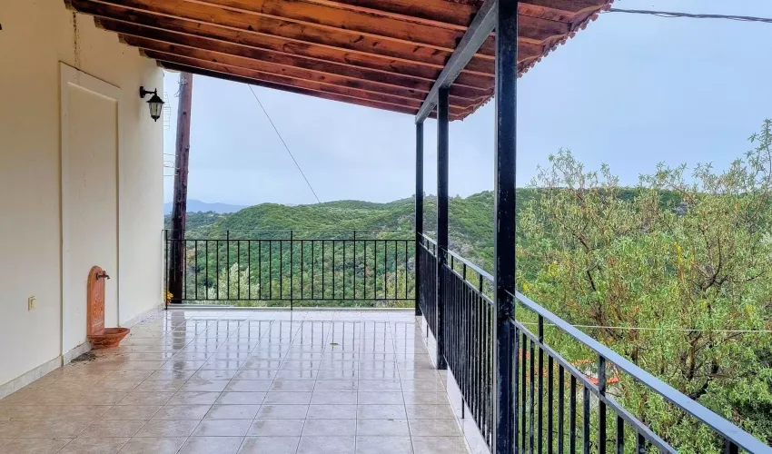mountain house for sale Greece, traditional house Mt Taygetos, property with views Peloponnese, two-apartment house Greece, peaceful village home, garden property Greece, house with verandas, property near Gytheio, house with fireplace Peloponnese, rural retreat Greece, Greek village property, house for nature lovers, year-round living Greece, mountain retreat Peloponnese, house with wooden finishes, scenic property Greece