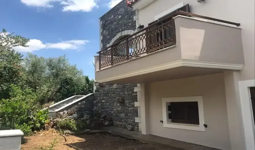 stone house for sale Greece, traditional home Gytheio, property in Konakia, house with mountain views, house with garden Peloponnese, two-storey house Greece, house with BBQ area, semi-finished property Gytheio, Greek village home, house with verandas and balconies, year-round living Greece, property near Gytheio, real estate Peloponnese, holiday home Greece, property with air conditioning and heating, house with water cistern