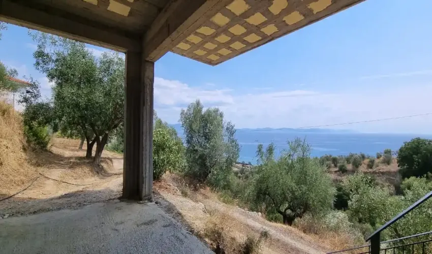sea view property, house with land, Gytheio property, Laconian Gulf views, olive grove, rural Greece, property with potential, tranquil location, Greek real estate, house with veranda, unfinished apartment space, Greek countryside, spacious home, property near beach, investment opportunity