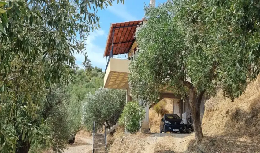 sea view property, house with land, Gytheio property, Laconian Gulf views, olive grove, rural Greece, property with potential, tranquil location, Greek real estate, house with veranda, unfinished apartment space, Greek countryside, spacious home, property near beach, investment opportunity