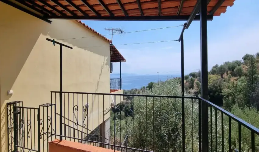 sea view property, house with land, Gytheio property, Laconian Gulf views, olive grove, rural Greece, property with potential, tranquil location, Greek real estate, house with veranda, unfinished apartment space, Greek countryside, spacious home, property near beach, investment opportunity